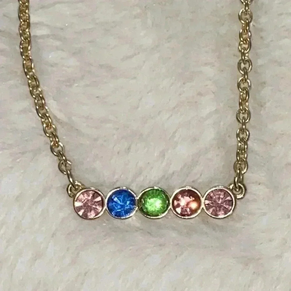 Gold tone necklace with pink, green and blue rhinestones